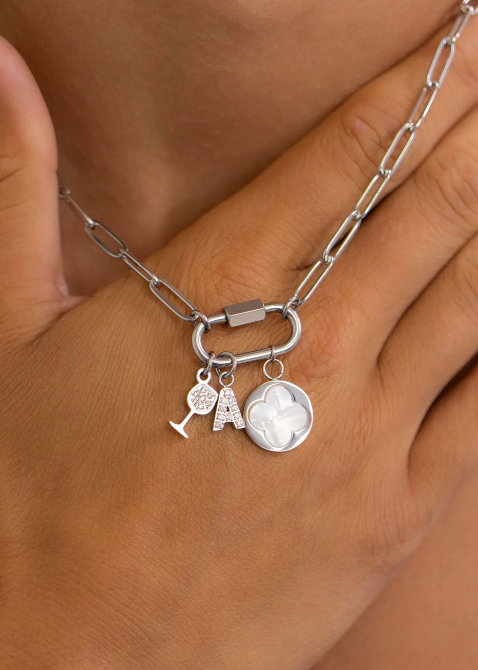 Silver paperclip carabiner necklace on grey display card