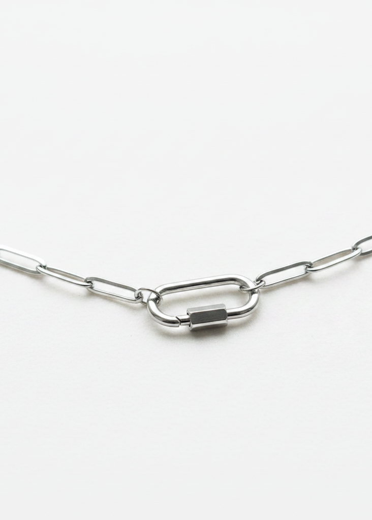 Silver carabiner clasp close-up on white background
