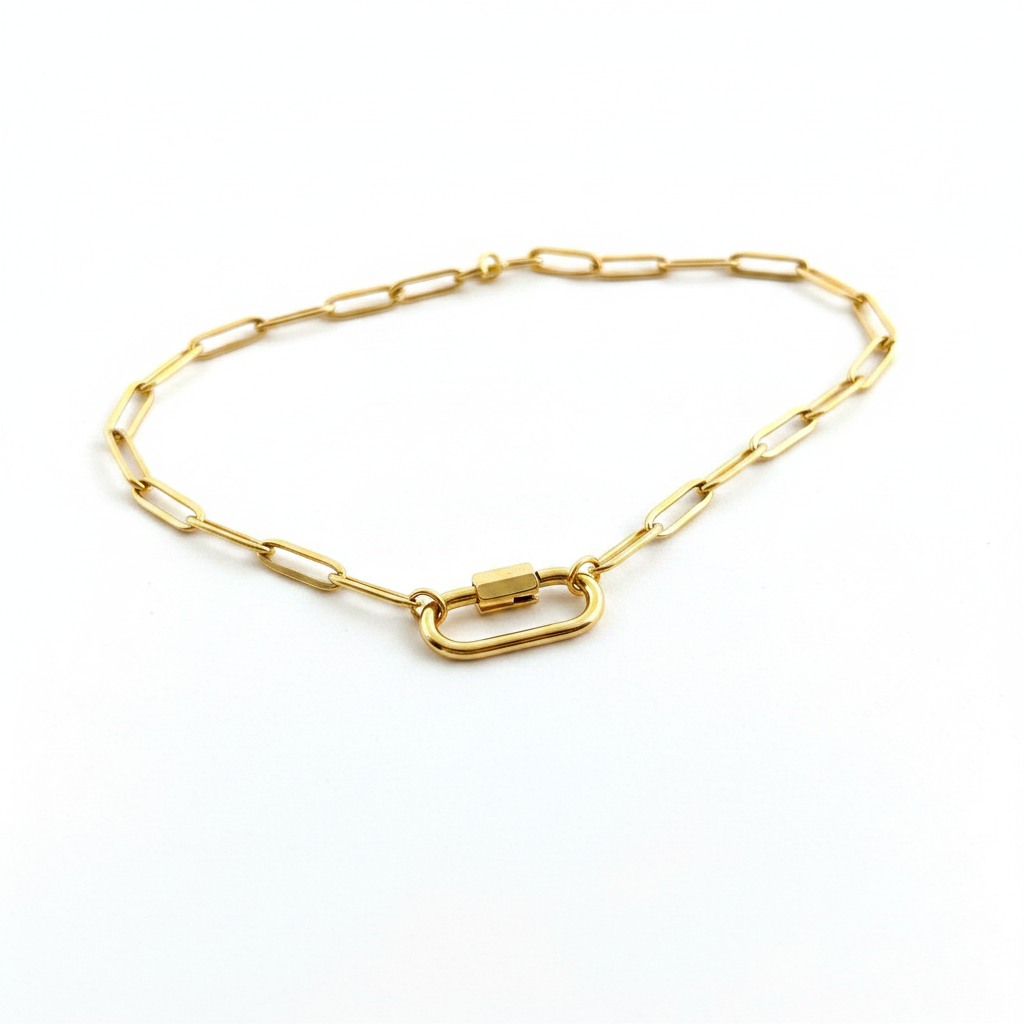 Gold carabiner clasp close-up on white background
