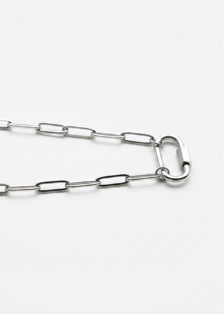 Silver paperclip chain close-up on white background