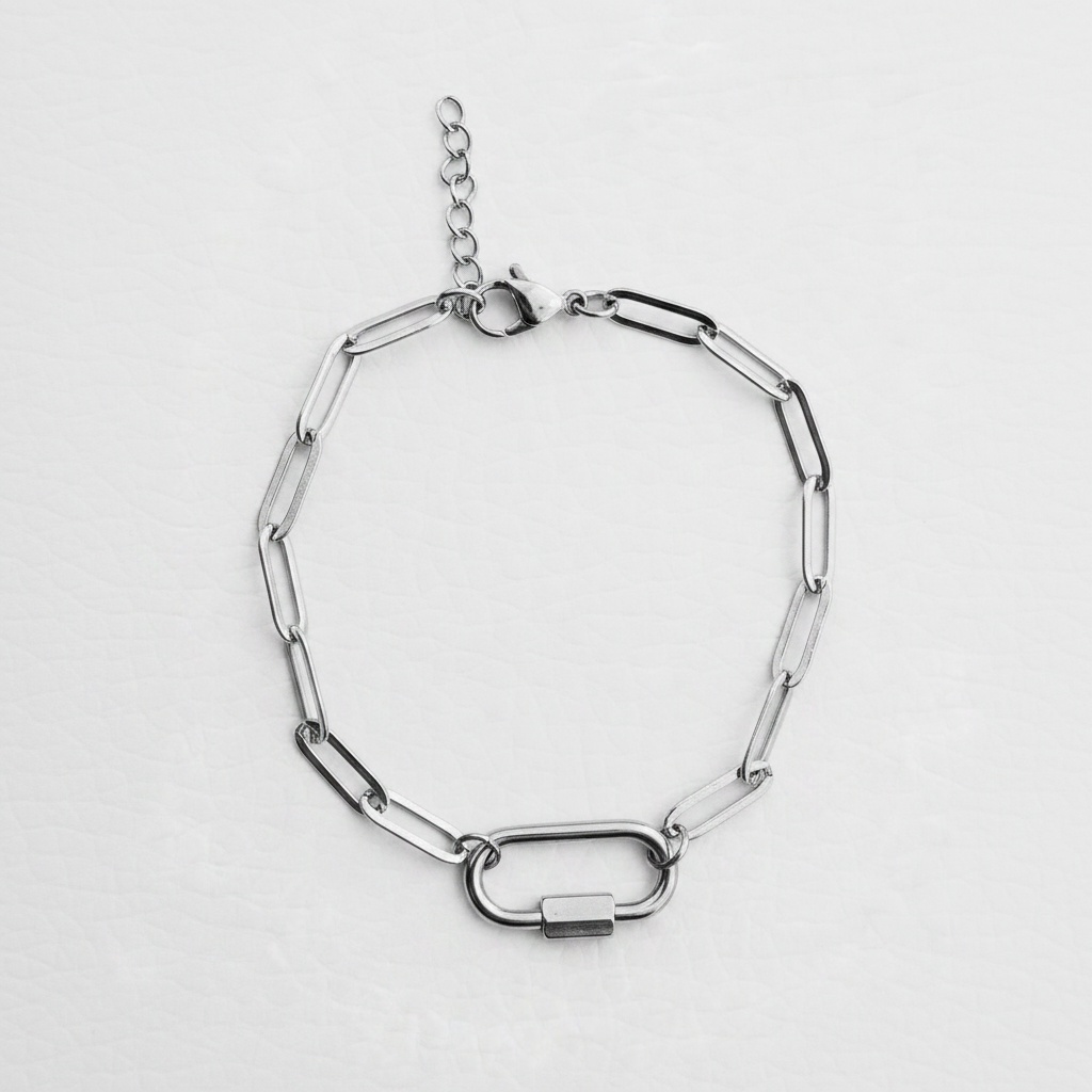 Silver paperclip charm bracelet on white background