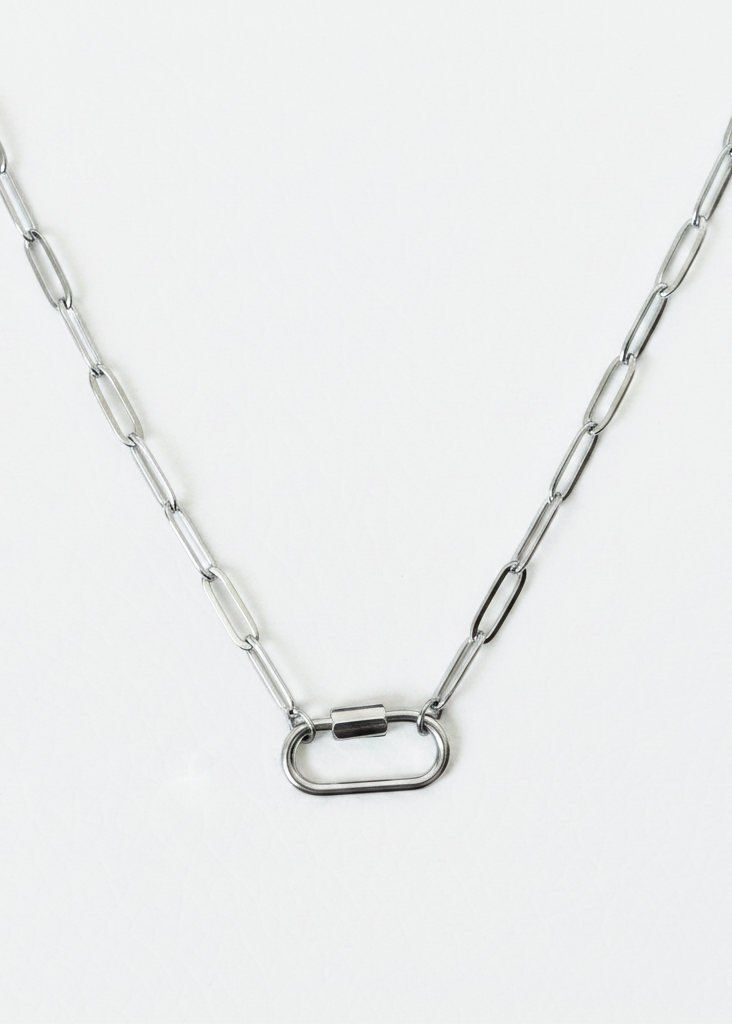 Silver paperclip carabiner necklace on white background